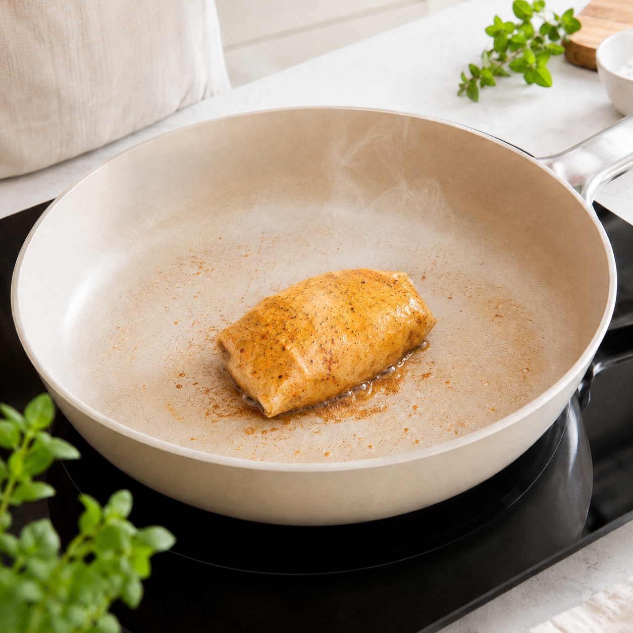 Chicken cooking inside a Flavour Sheet in a frying pan